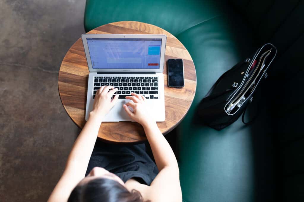 Woman typing on computer